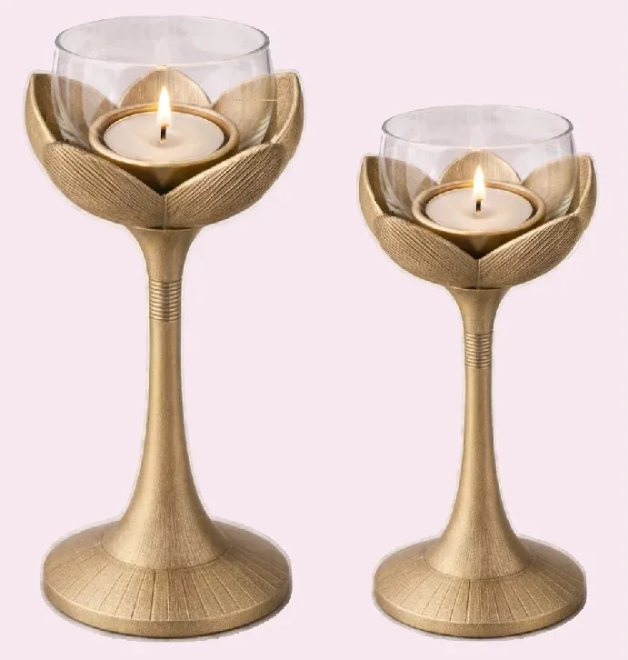 Lotus candle holders in brushed brass with removable glass cups