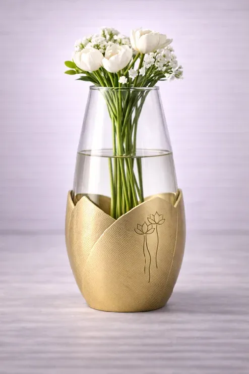 Lotus Bliss vase: clear glass in a brushed brass petal sleeve